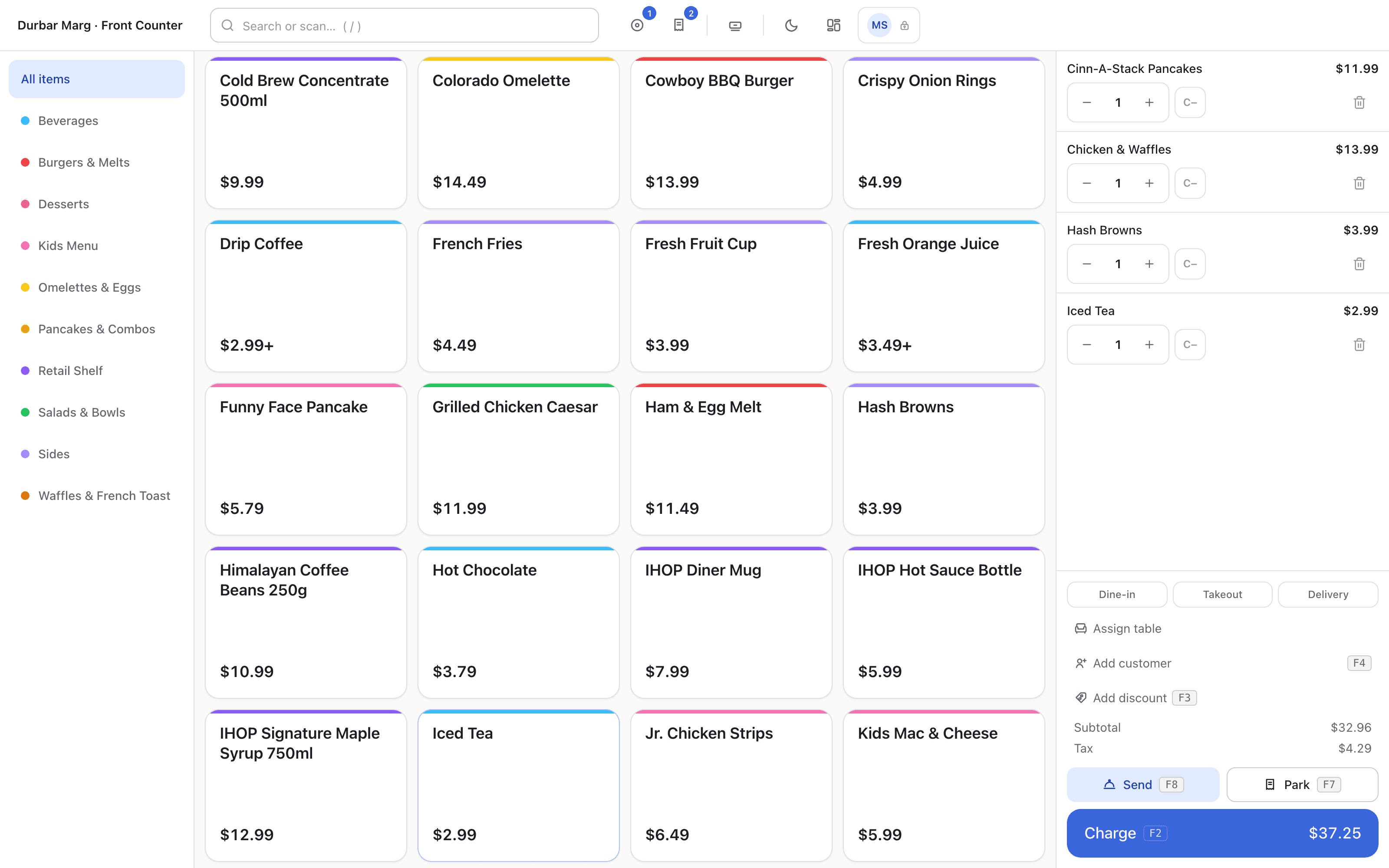 The register: product grid, live cart and the Charge total